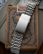 Load image into Gallery viewer, Silver Smiths watch on an old book with a detailed cover